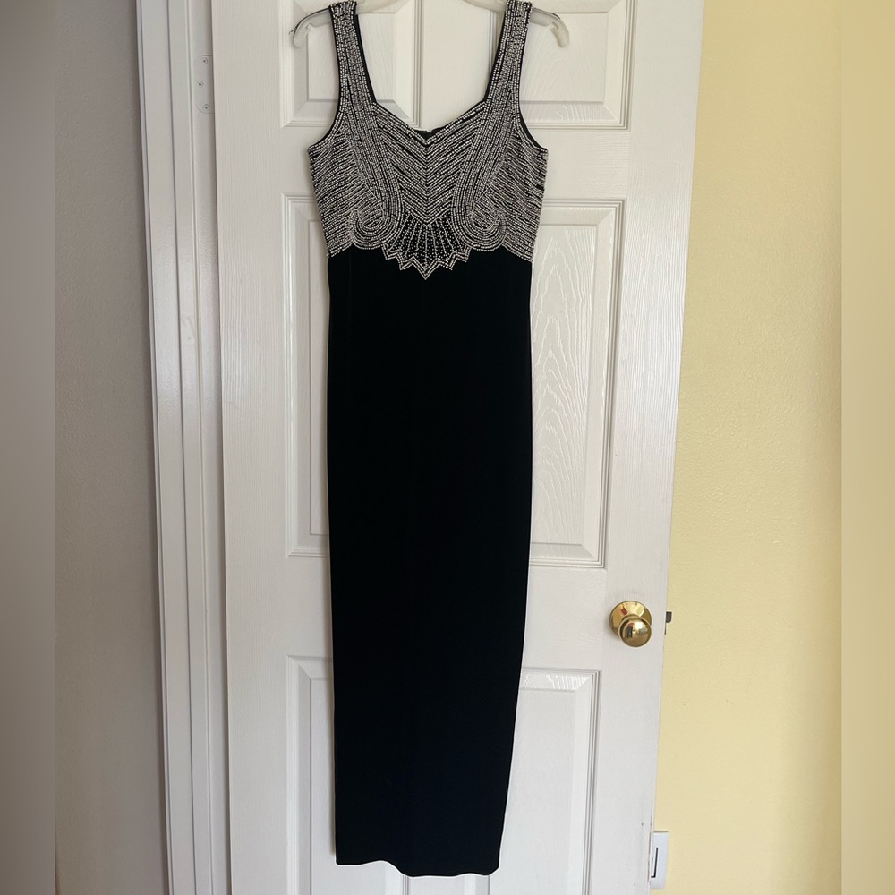 Vintage black velvet Stenay gown with art deco beaded bodice in silver. Size 8.